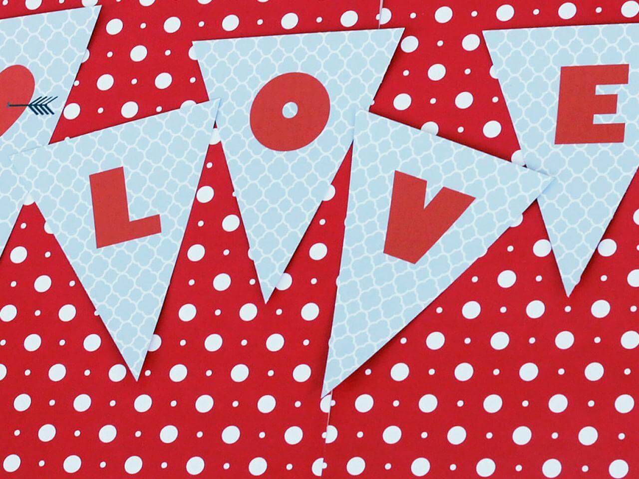 A red and white banner with white polka dots
