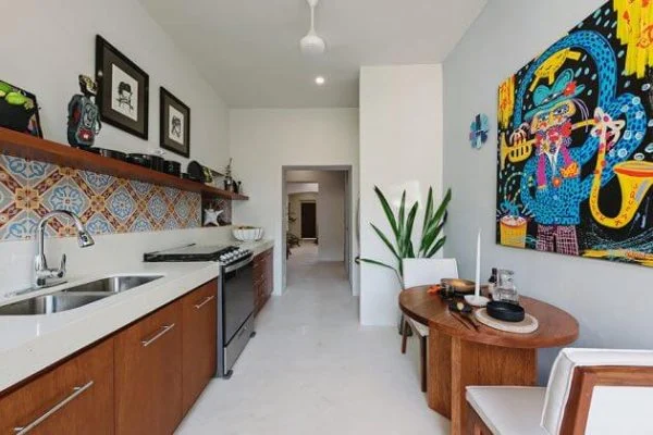 Casa Picasso kitchen with a sink, stove and a painting on the wall idea
