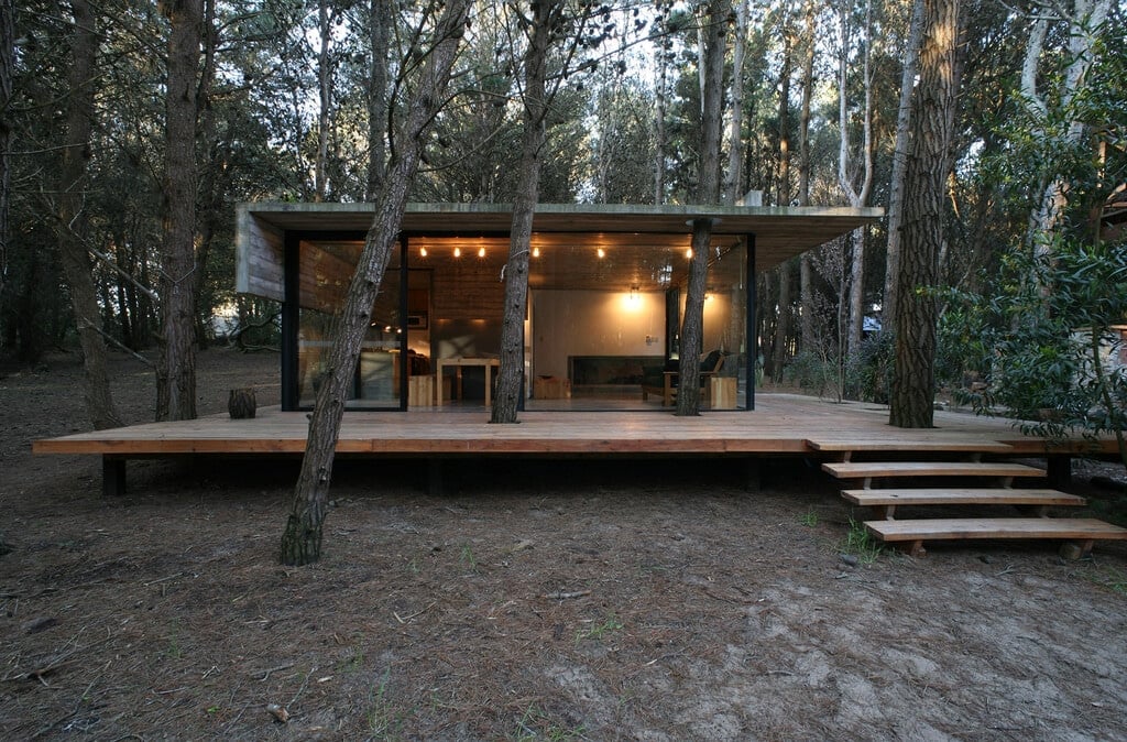 A small cabin in the middle of a forest
