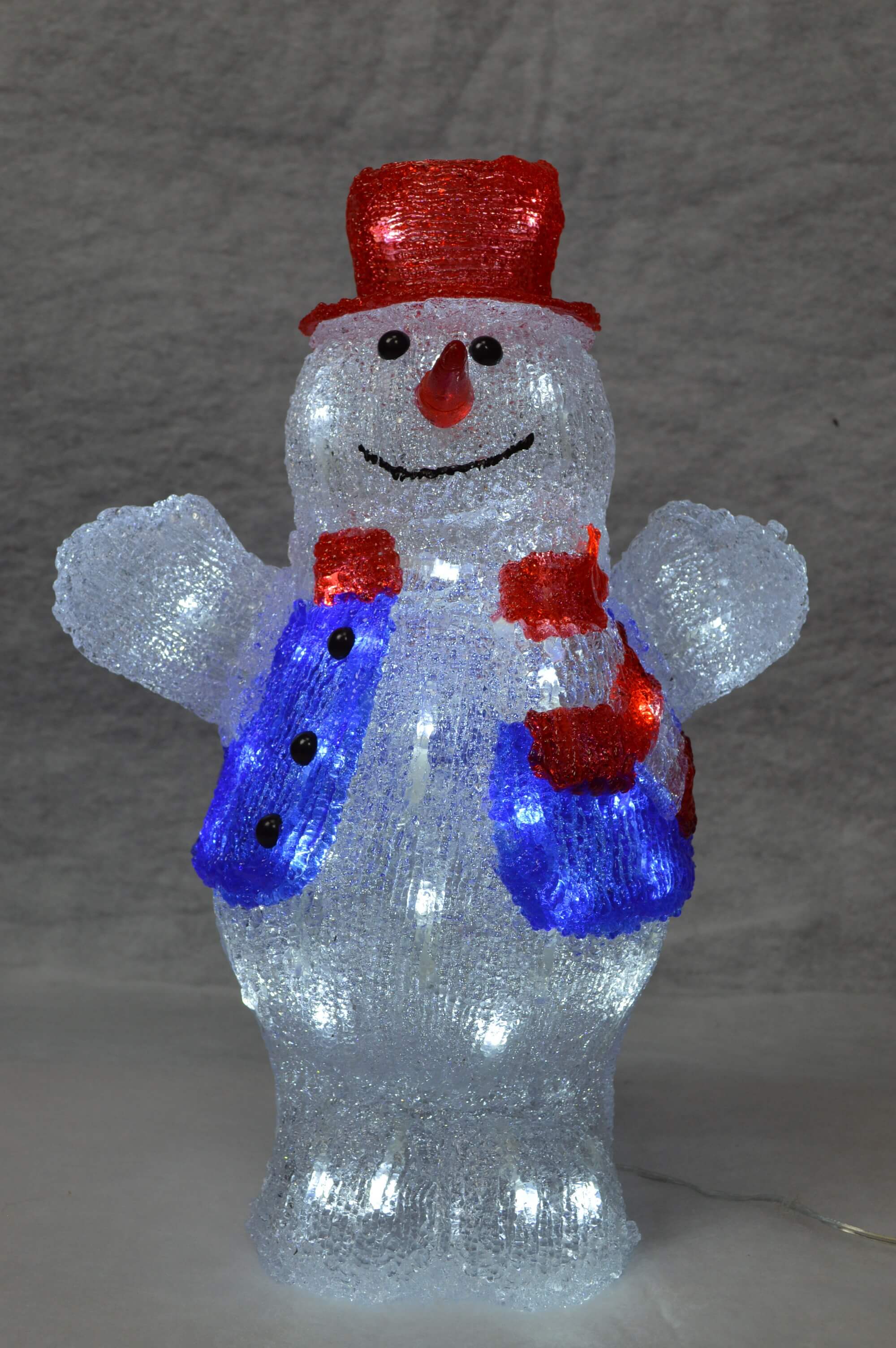 A lighted snowman with a red hat and scarf
