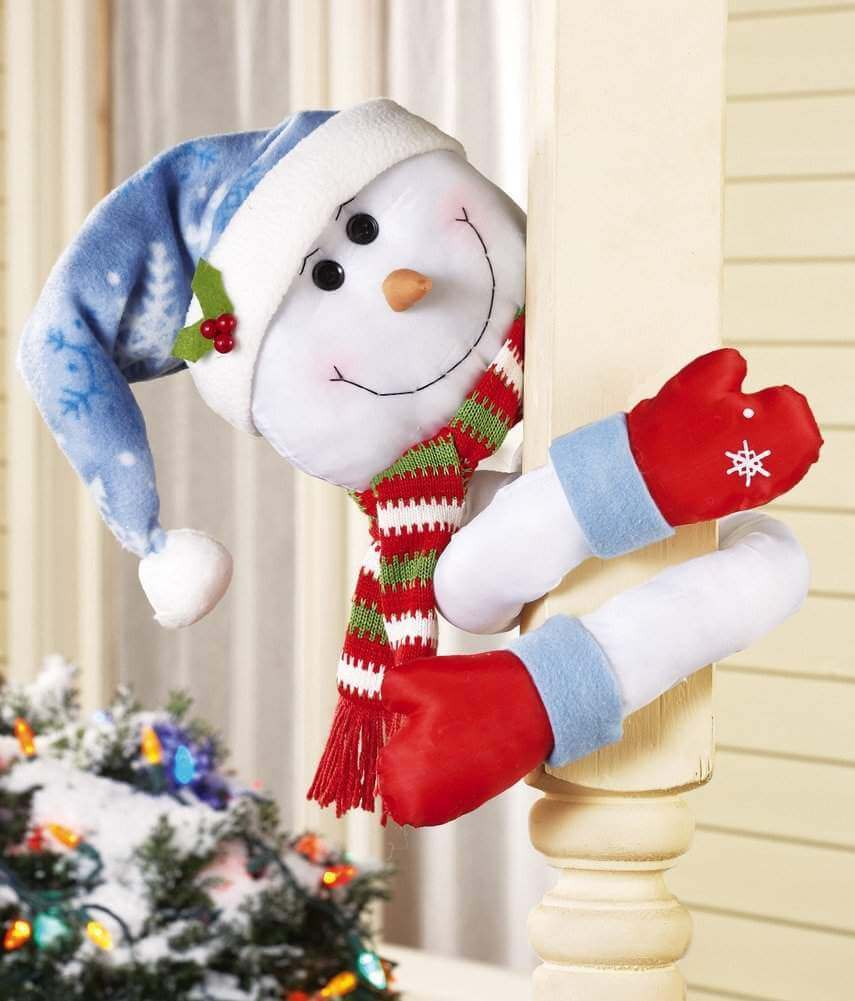 A snowman wearing a red and blue hat and scarf
