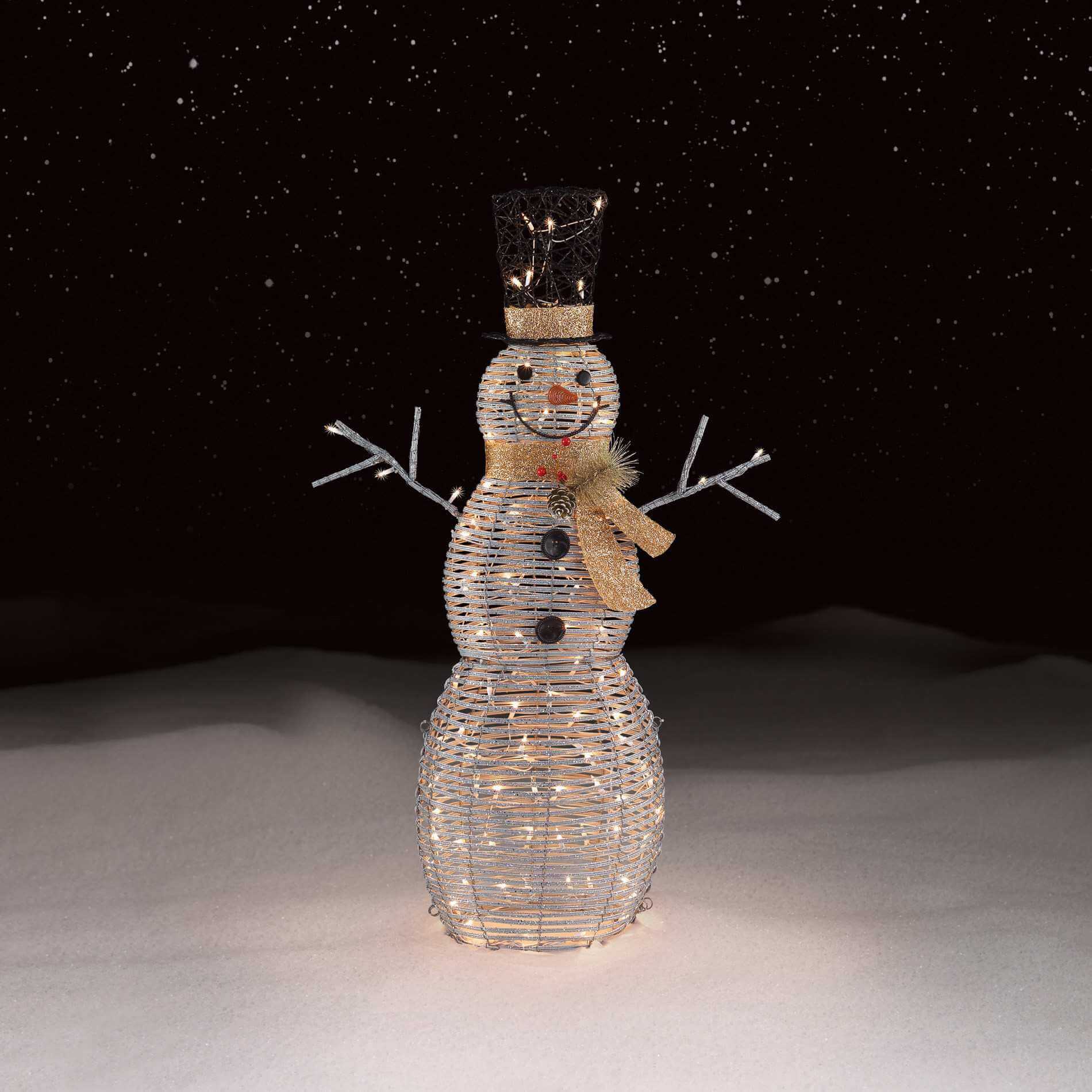 A lighted snowman with a crown on it's head
s