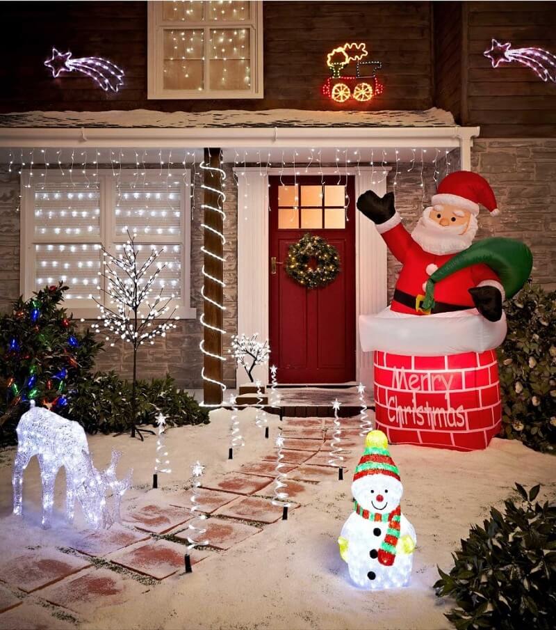 A christmas scene with a santa clause and a snowman
