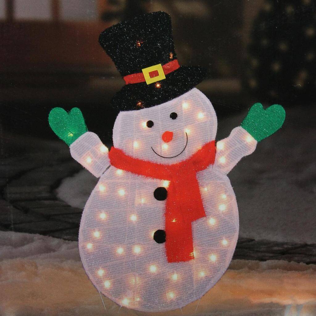 A lighted snowman with a hat and scarf
