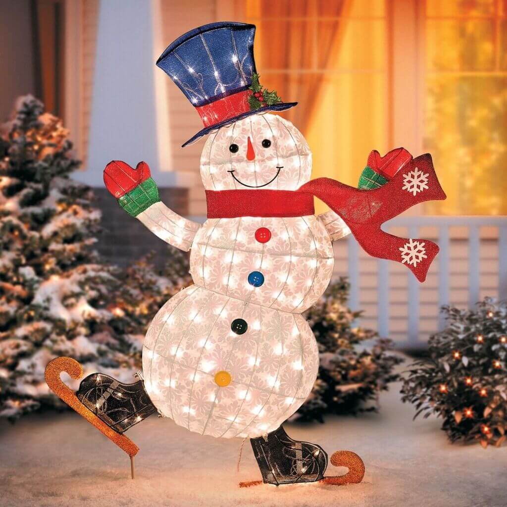 A lighted snowman with a hat and scarf
