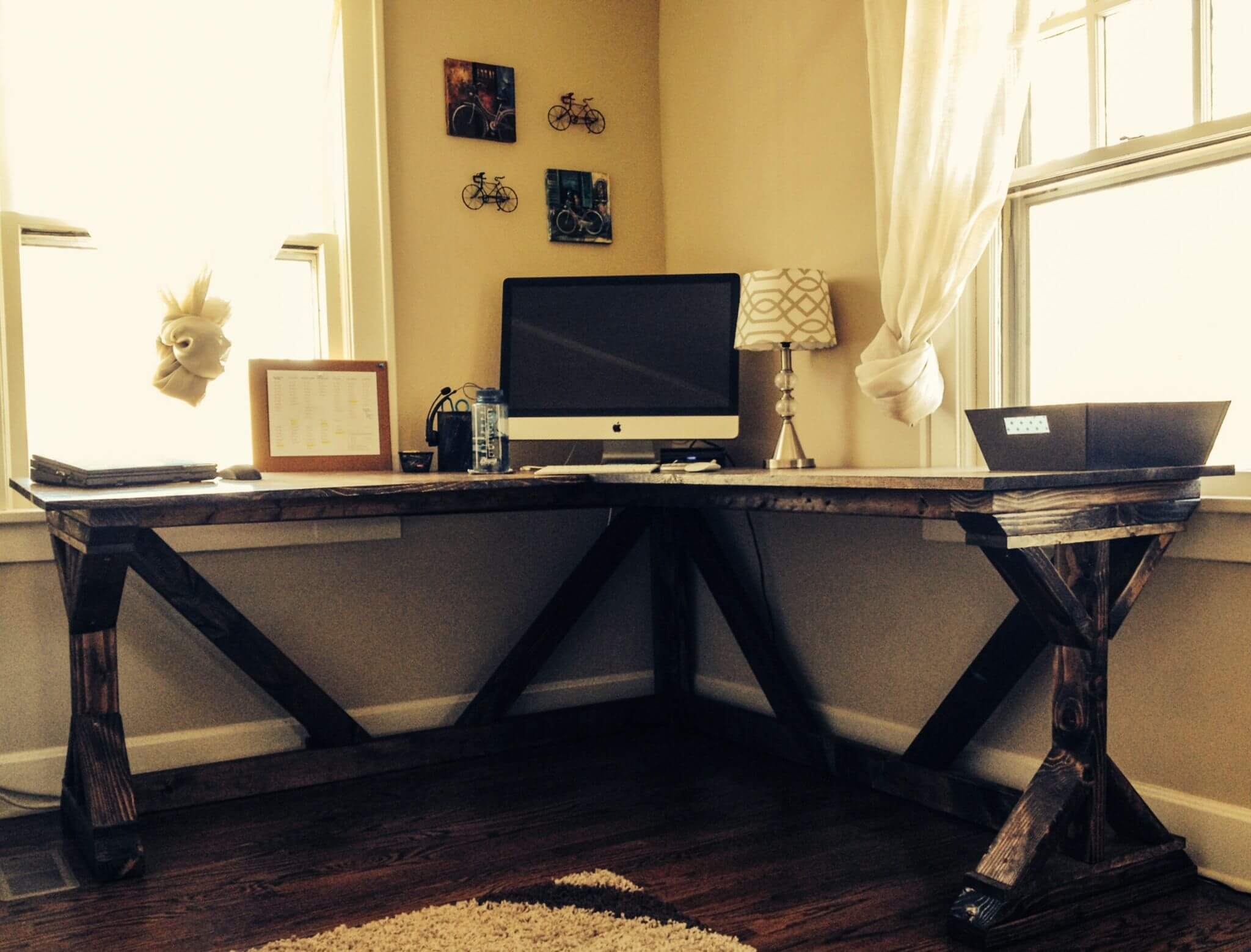 A desk with a computer on top of it
