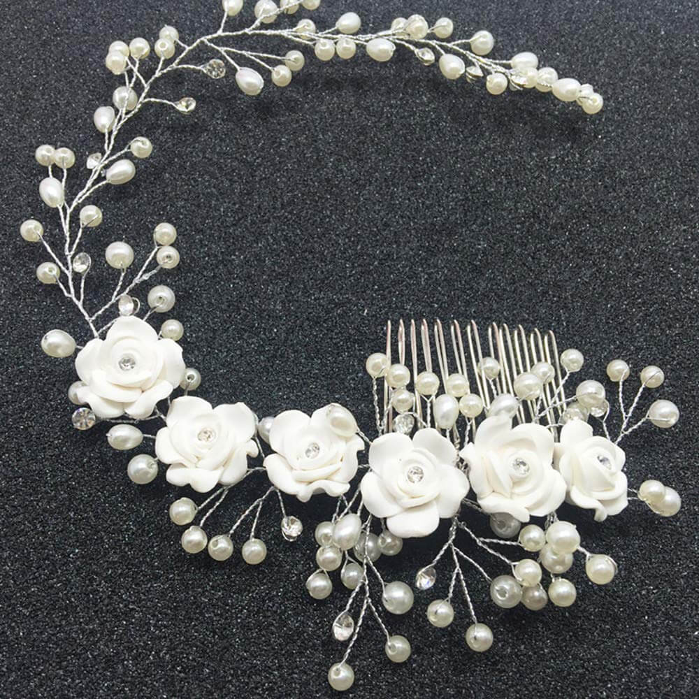 A bridal hair comb with flowers and pearls
