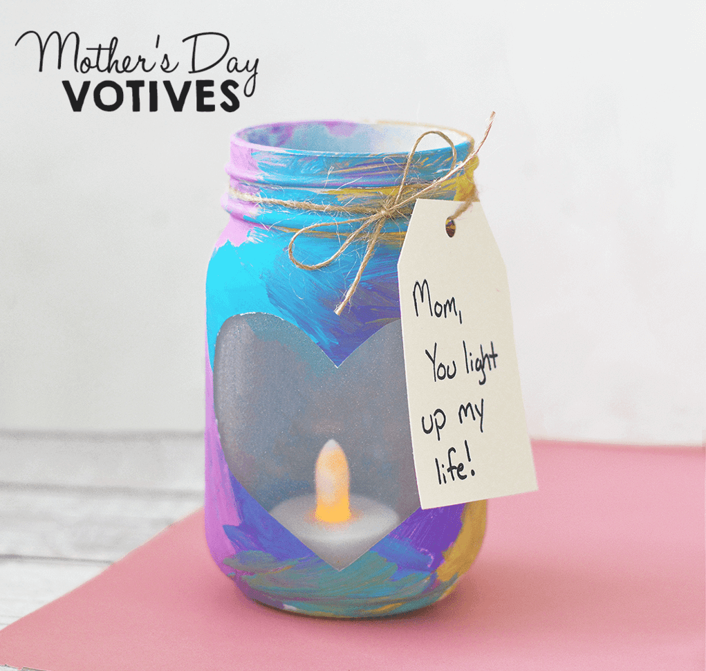 A jar with a candle and a tag on it
