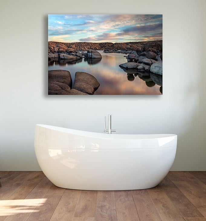 A bath tub sitting on top of a wooden floor
