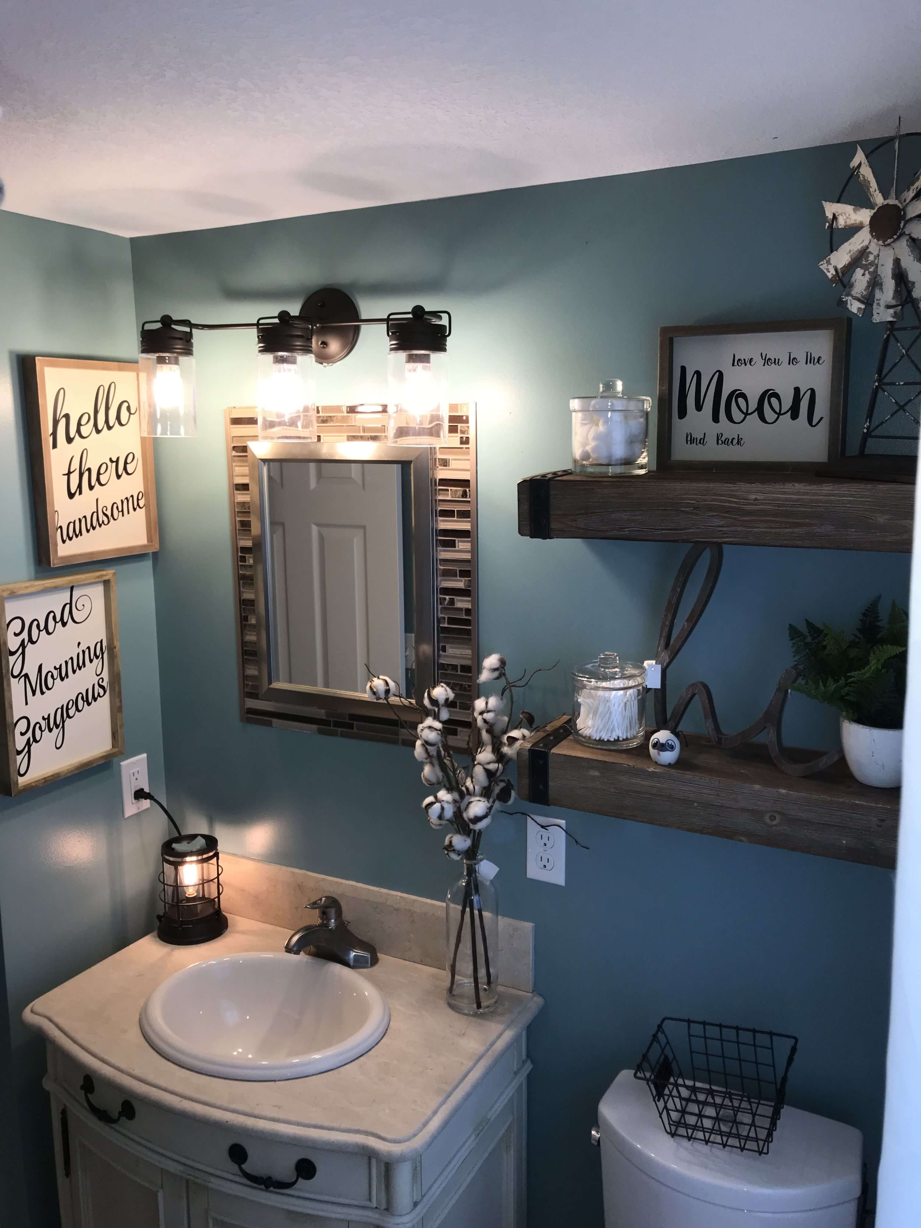 A bathroom with blue walls and a white sink
