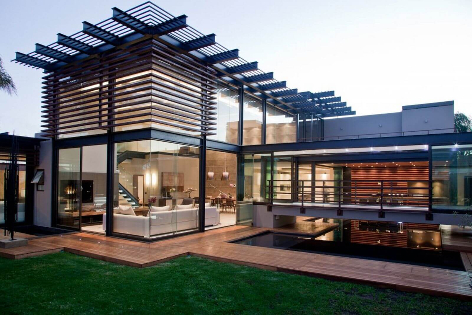 A modern house with a covered patio and a living room
