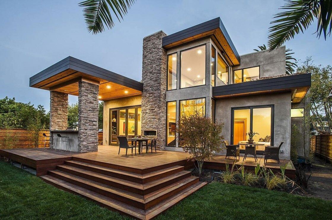 A modern house with a deck and a patio
