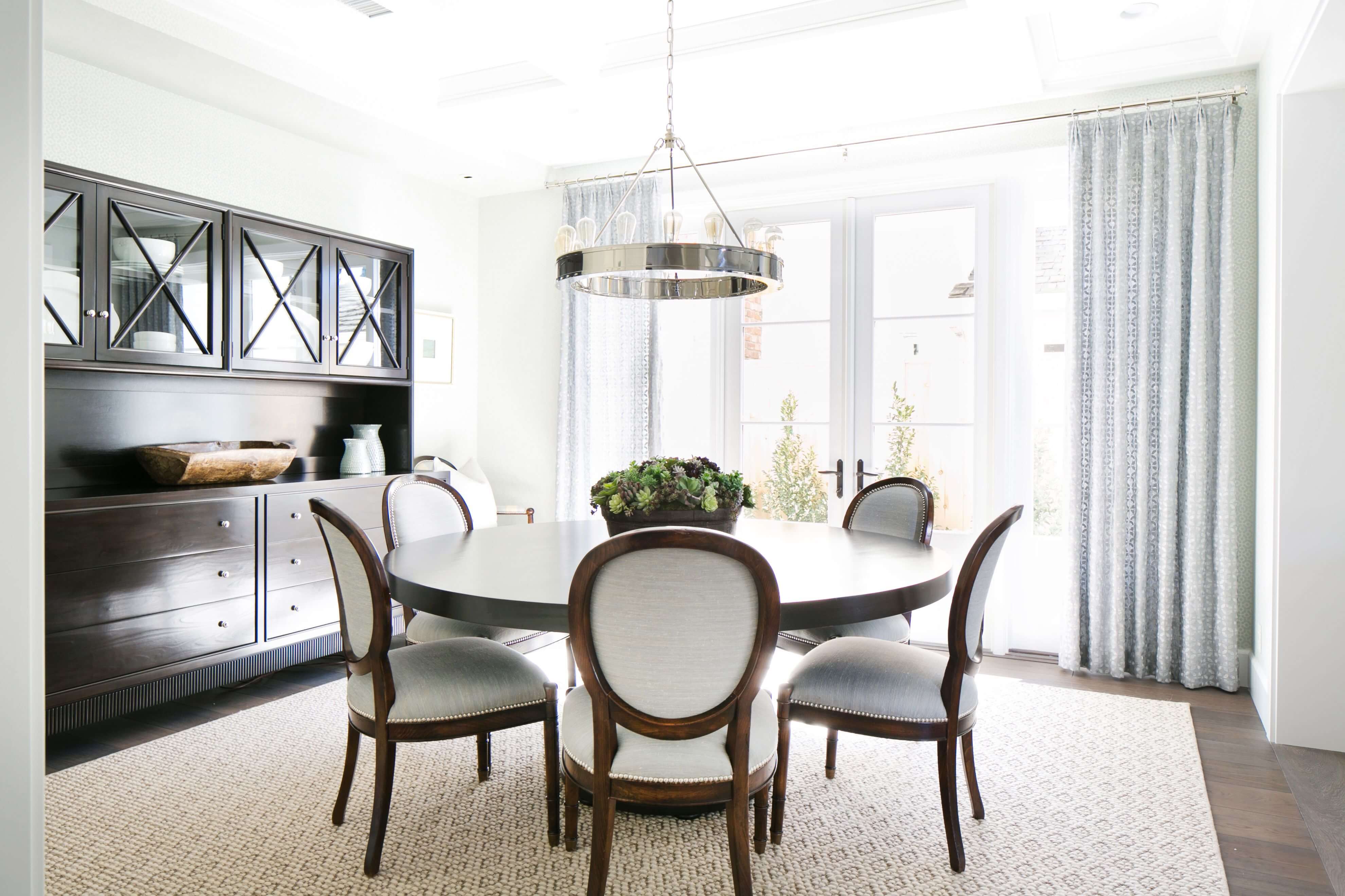 A dining room with a table and chairs
