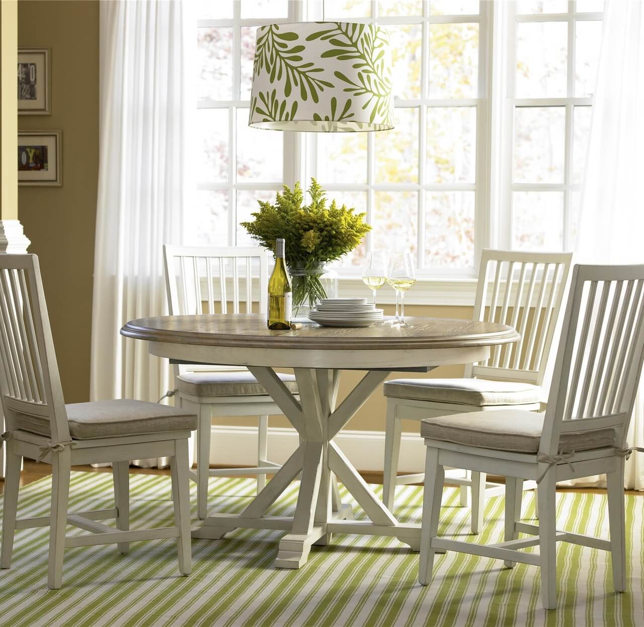 A round white table and chairs in a room
