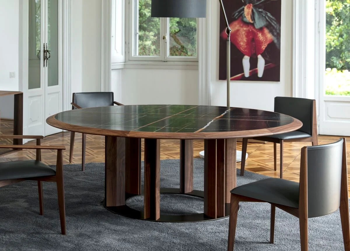 A round dining room with a round table and chairs
