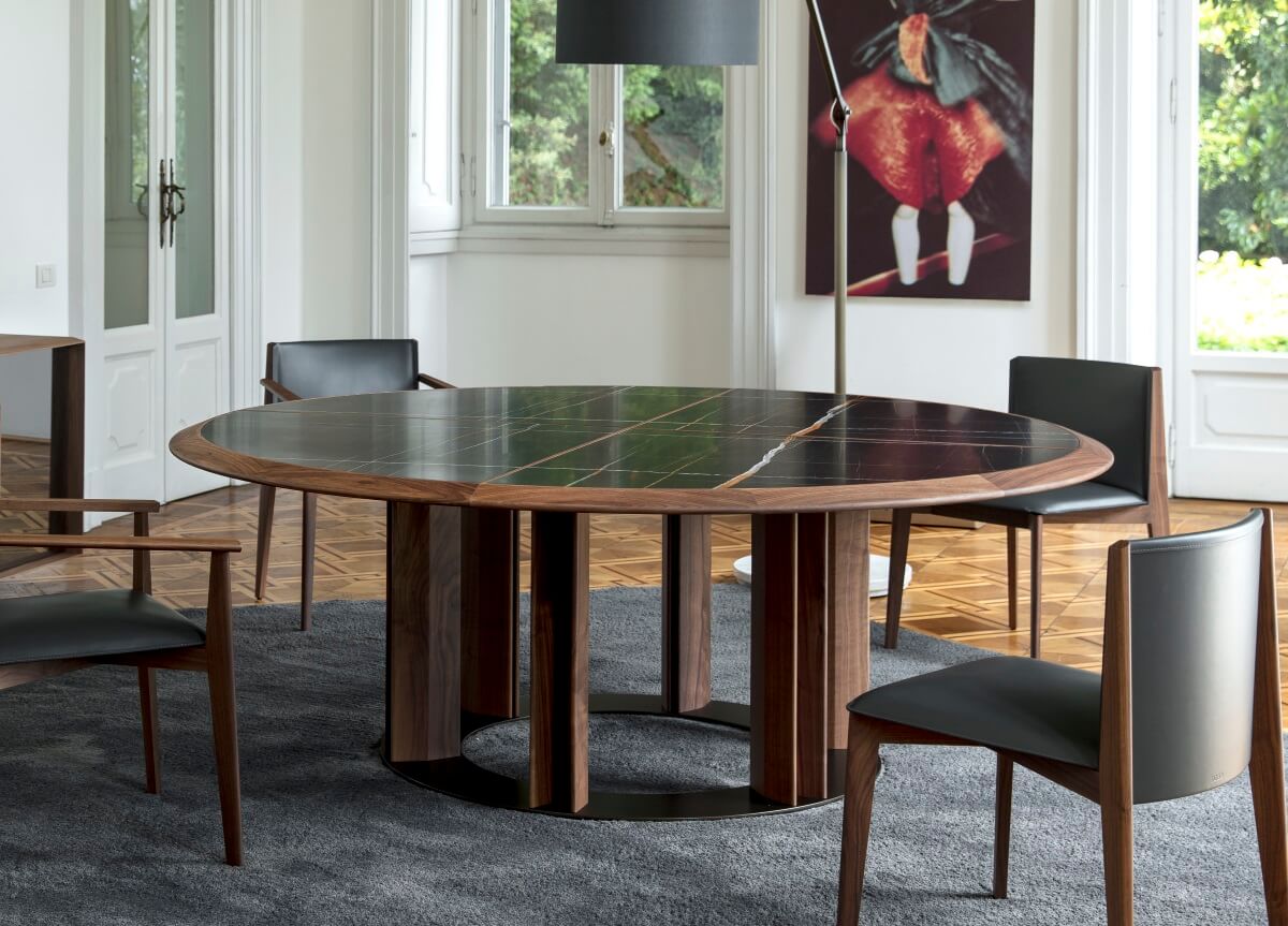 A round dining room with a round table and chairs
