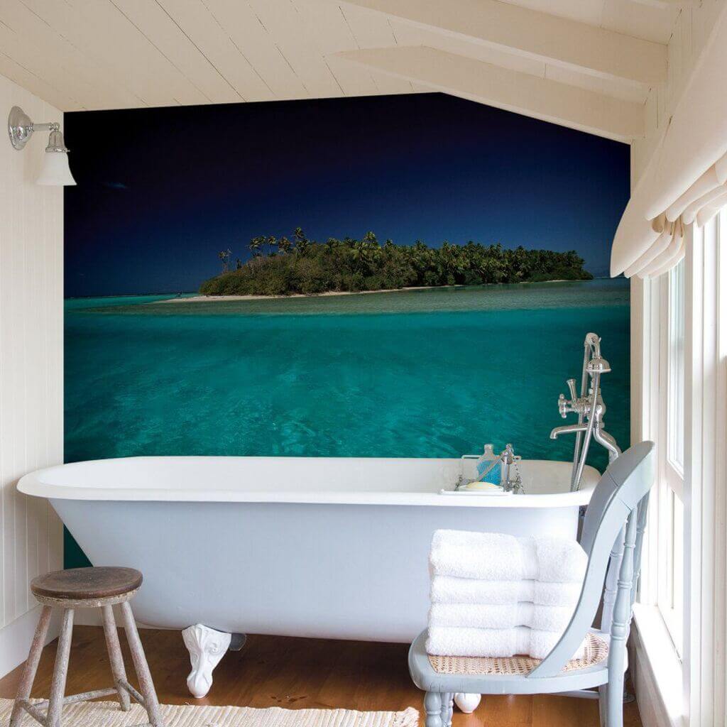 A bathroom with a bathtub and a wall mural
