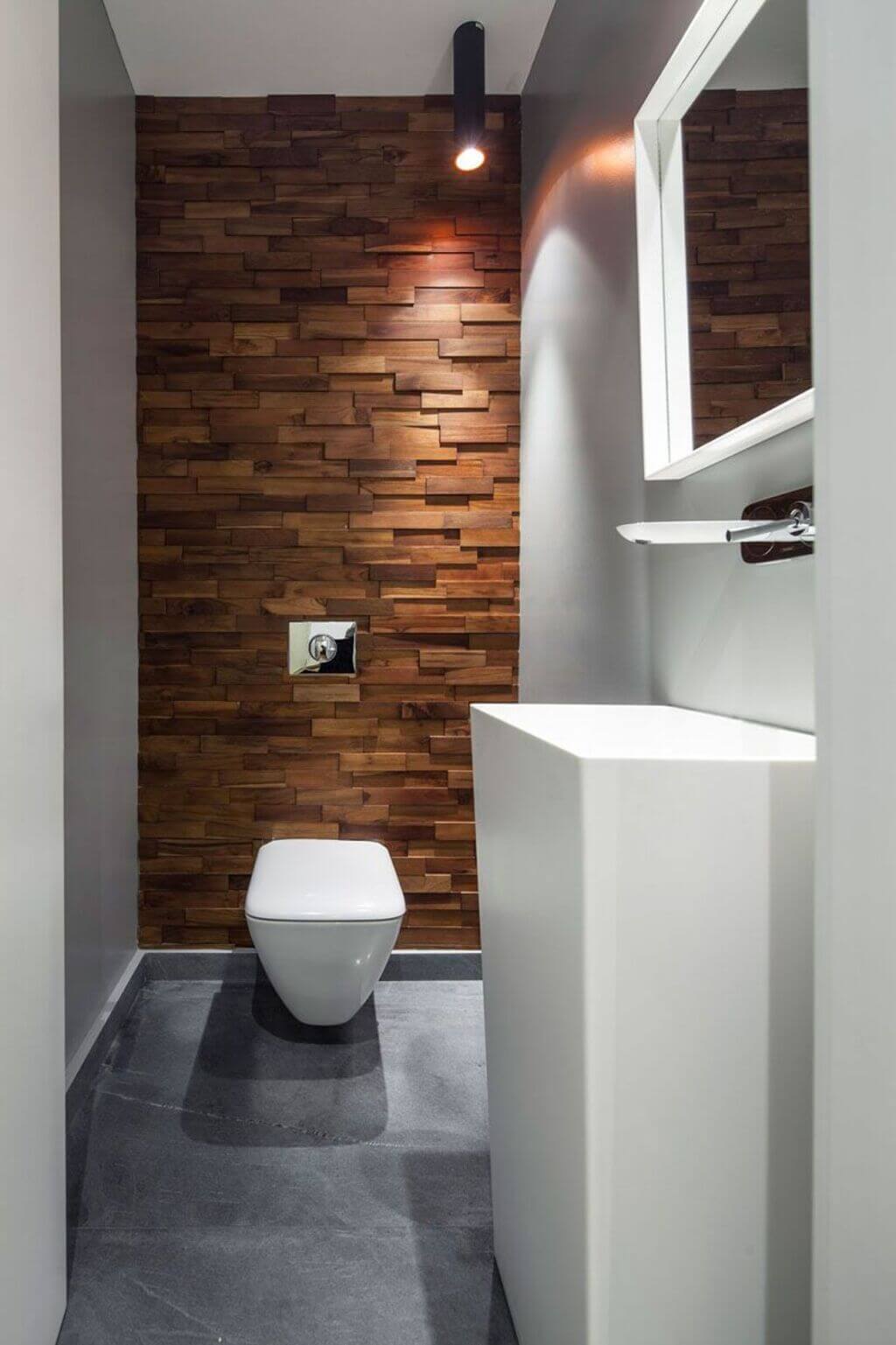 A white toilet sitting in a bathroom next to a sink
