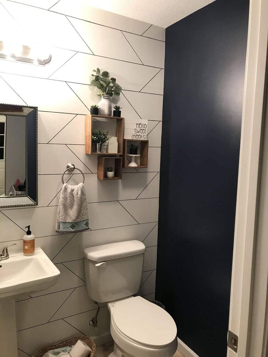 A white toilet sitting next to a bathroom sink
