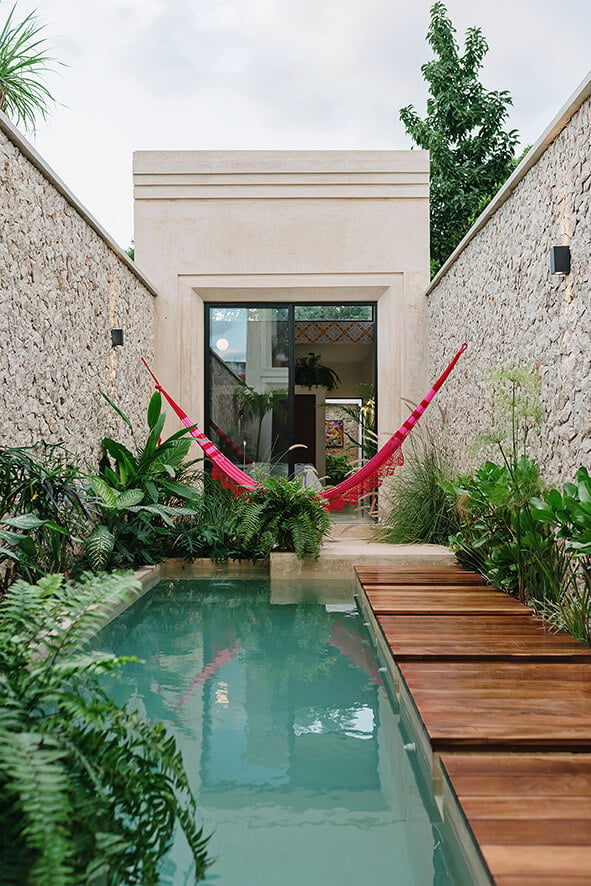 Casa Picasso : A pool with a hammock in the middle of it
