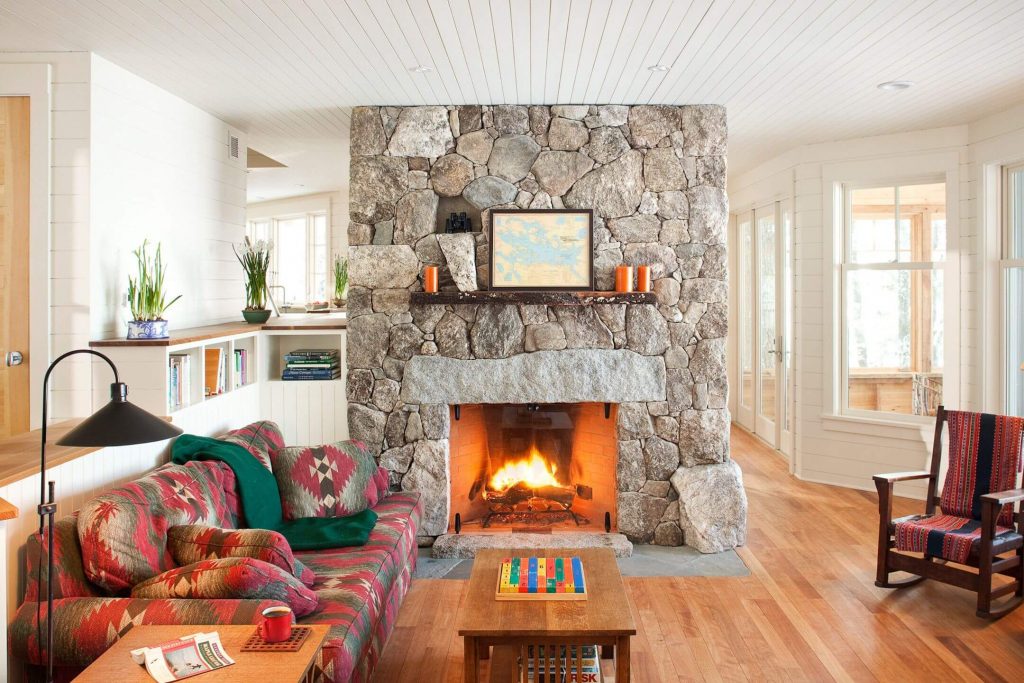 A living room filled with furniture and a 
 neutral fire place
