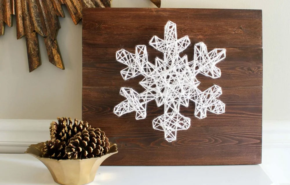 A wooden sign with a snowflake on it
