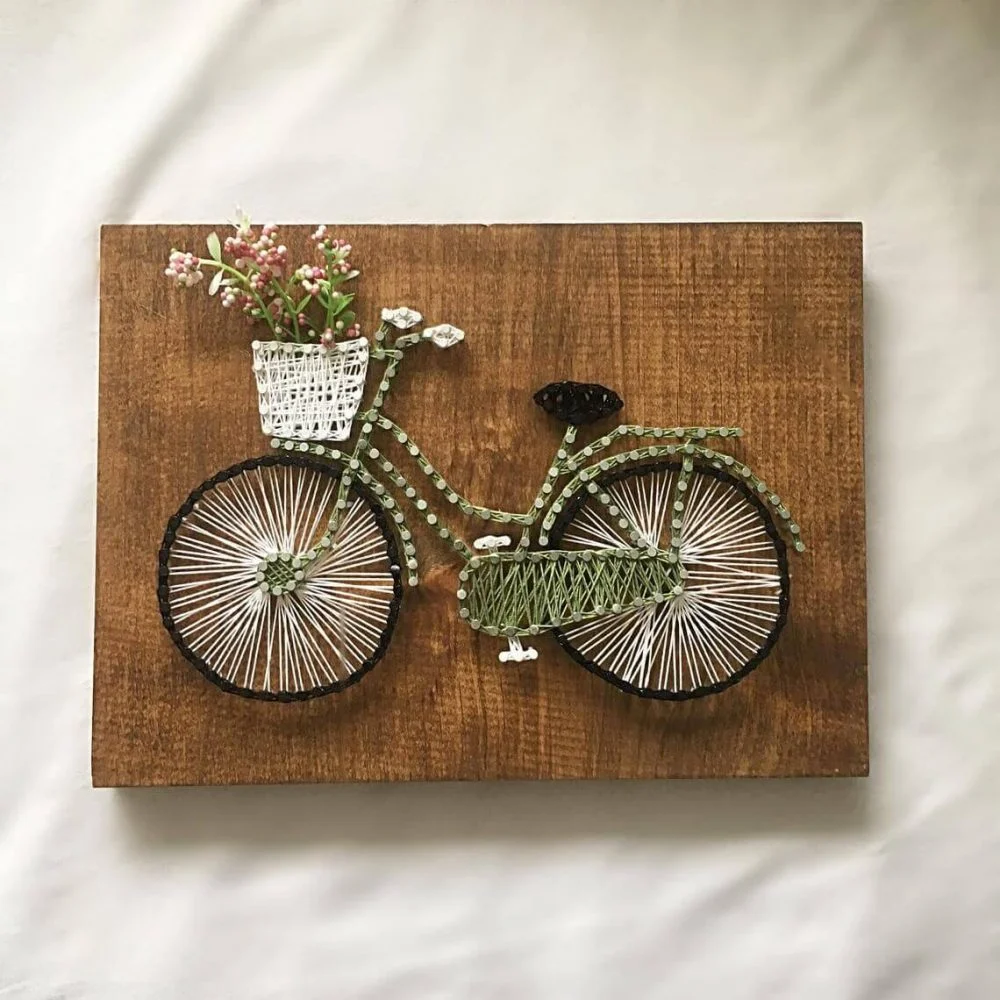A picture of a bicycle with a basket of flowers
