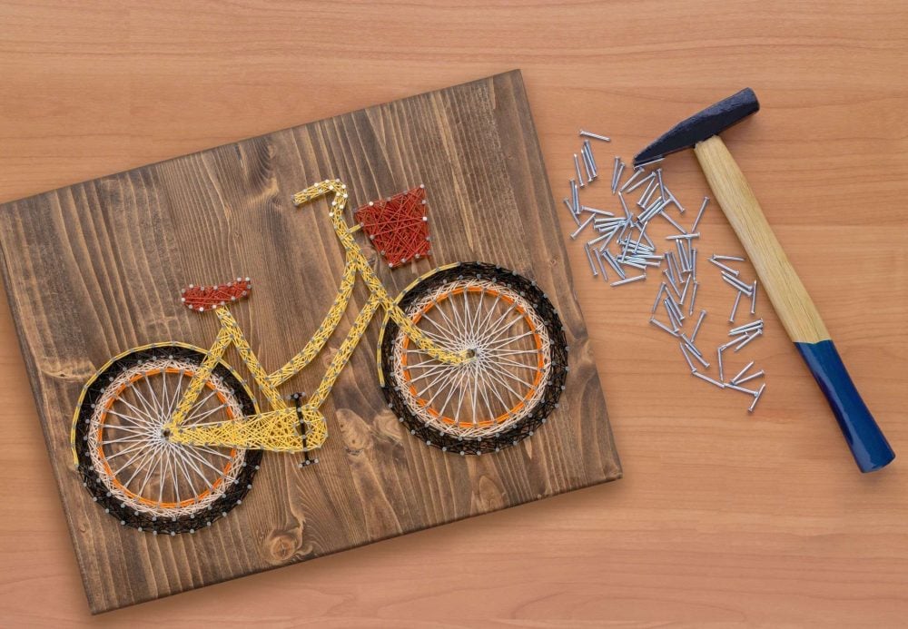 A picture of a bike on a wooden board
