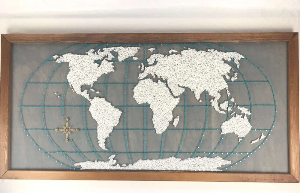 A picture of a world map made out of beads
