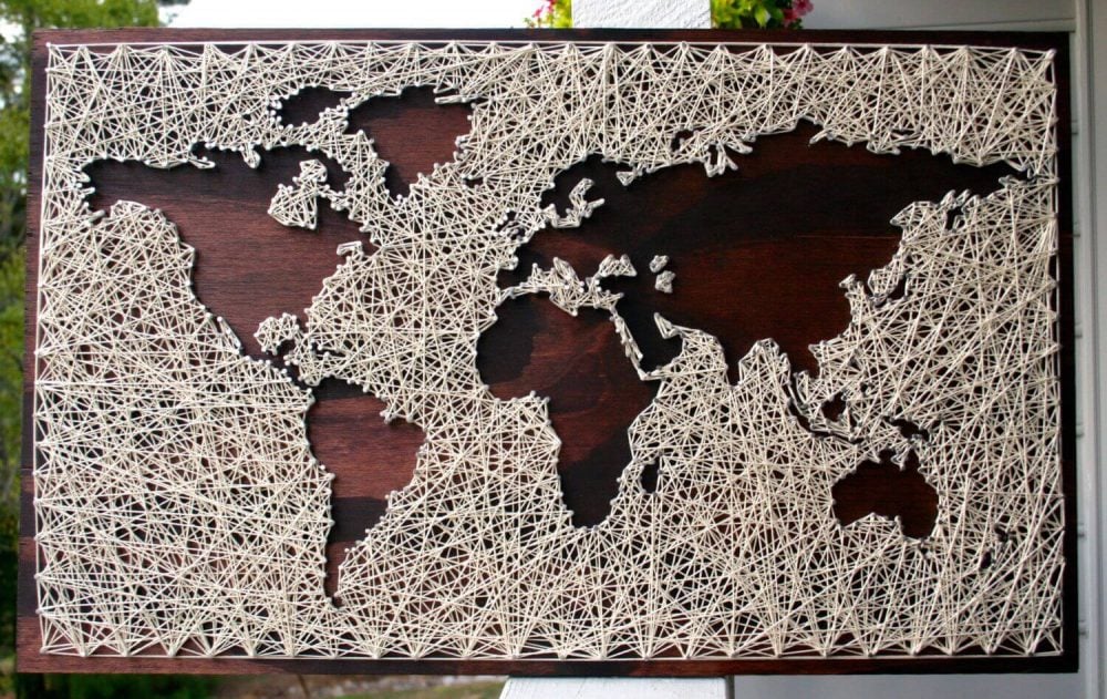 A picture of a world map made out of string

