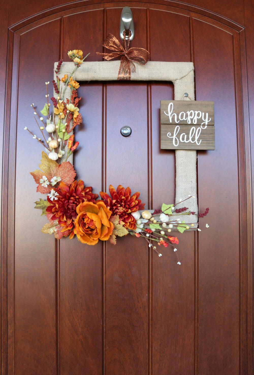 A wooden door with a happy fall sign on it
