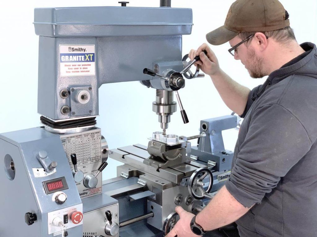 A man working on a machine in a factory
