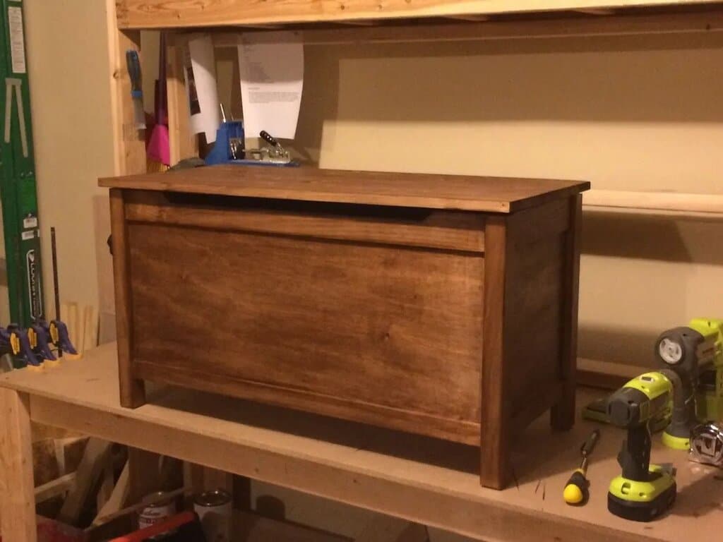 A workbench with a tool box and drillers
