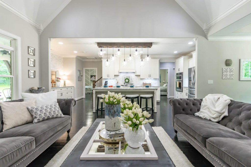 A living room filled with furniture and a center table
