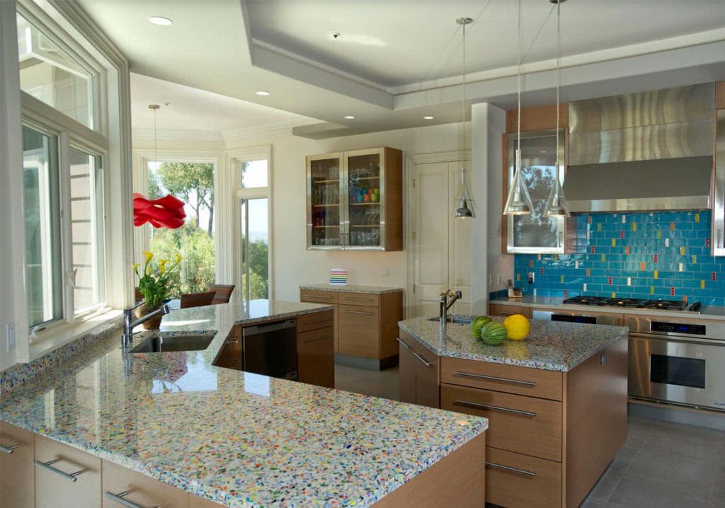 A kitchen with a center island and a sink
