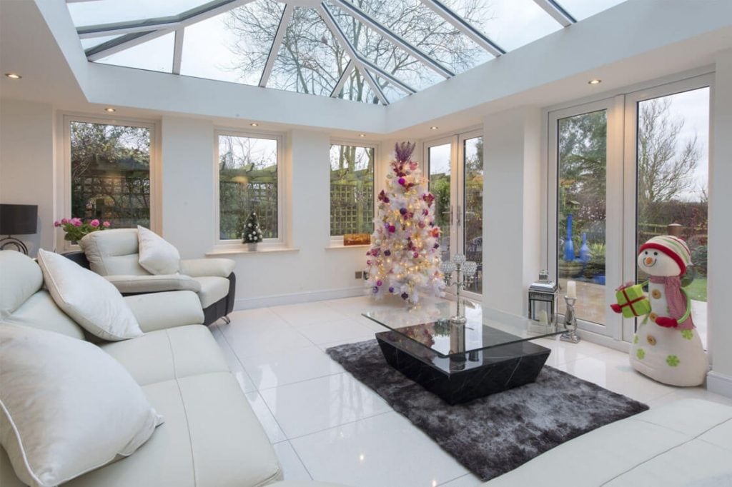 A living room filled with furniture and a christmas tree
