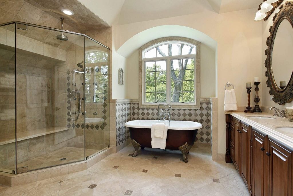 A large bathroom with a claw foot tub
