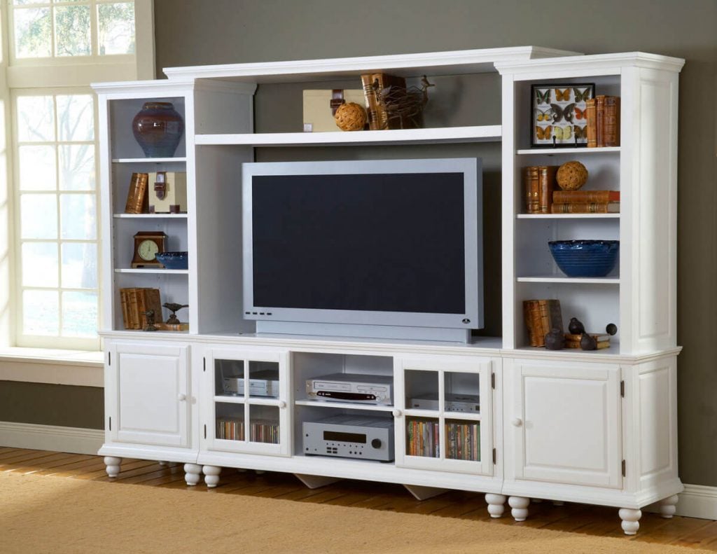A white entertainment center with a flat screen tv
