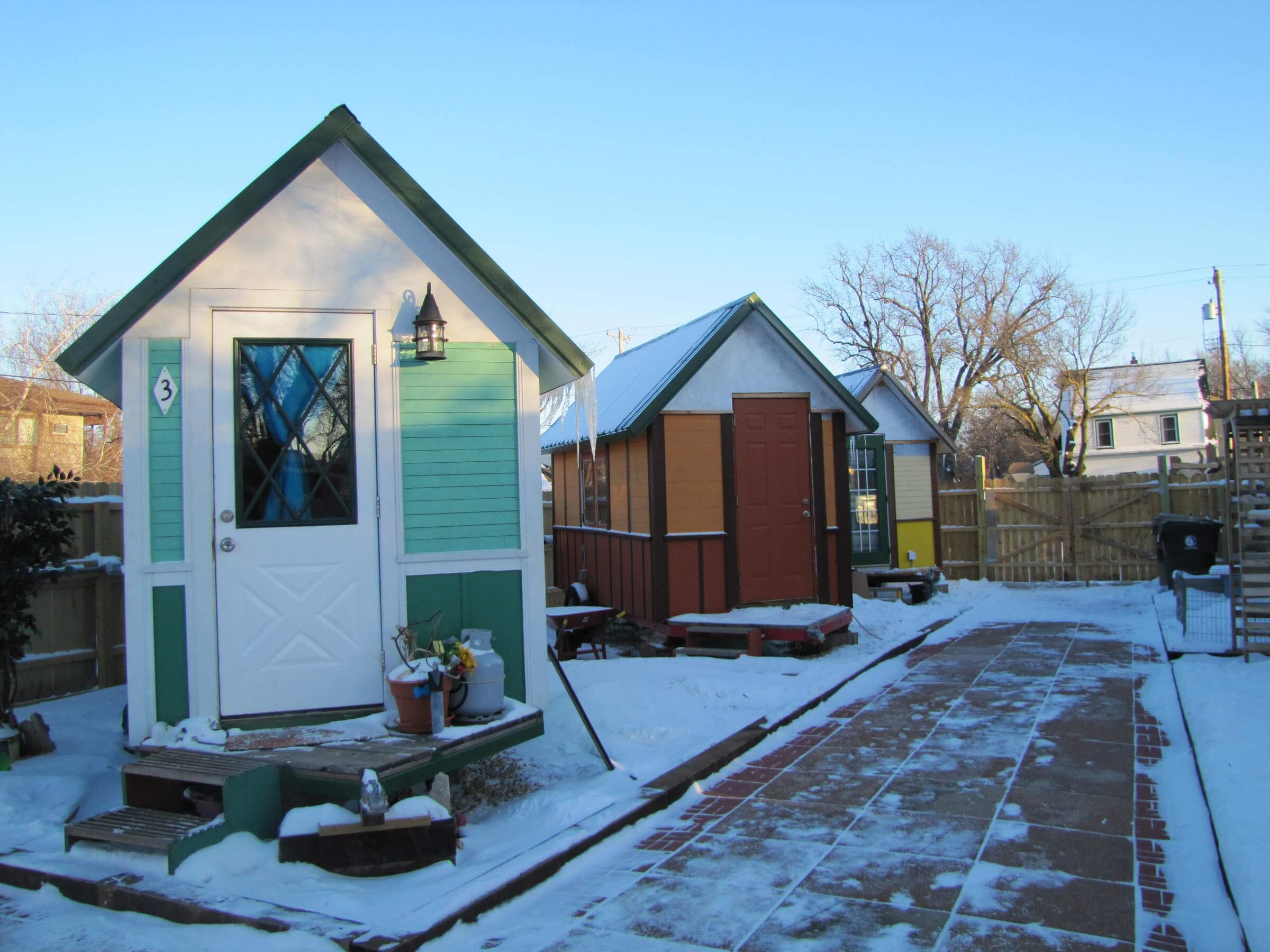 tiny house community among snow