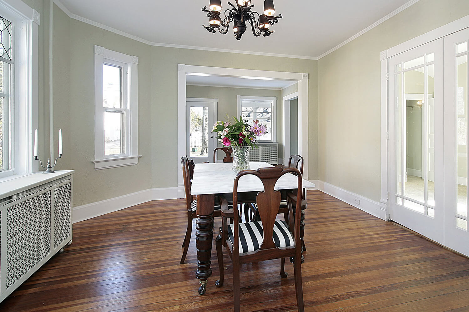 A dining room with a table and chairs
