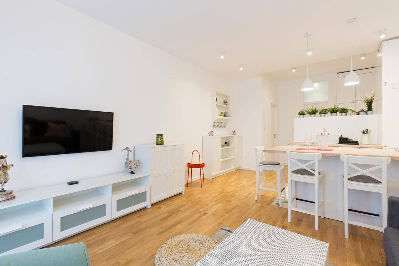 A living room filled with furniture and a flat screen tv
