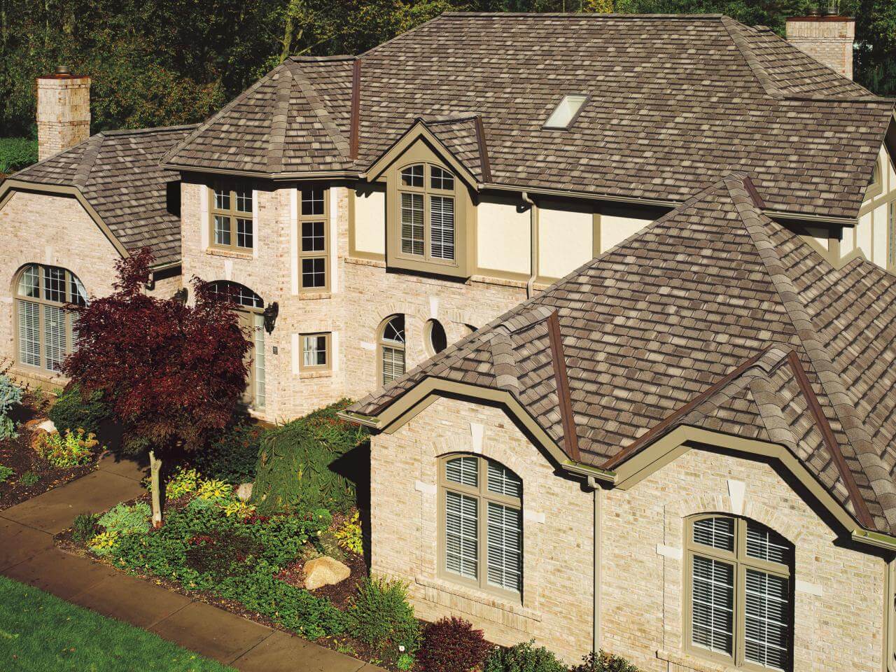 An aerial view of a house with a brown roof
