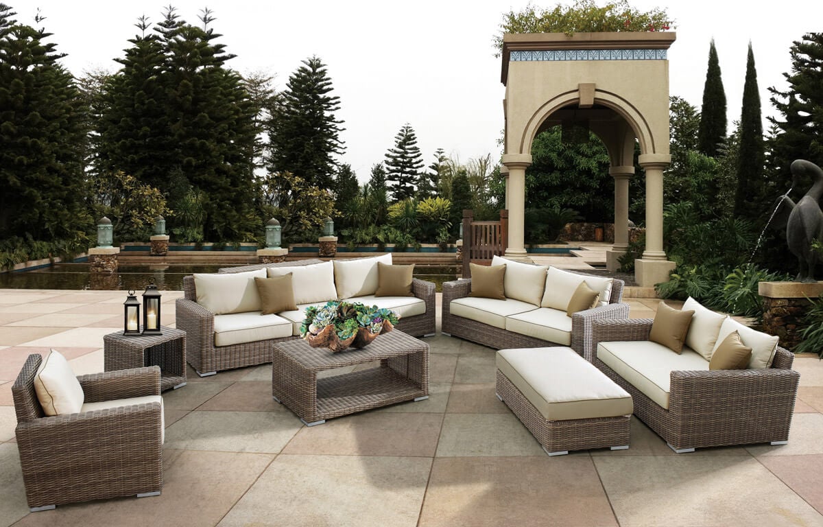 A patio with a lot of couches and tables
