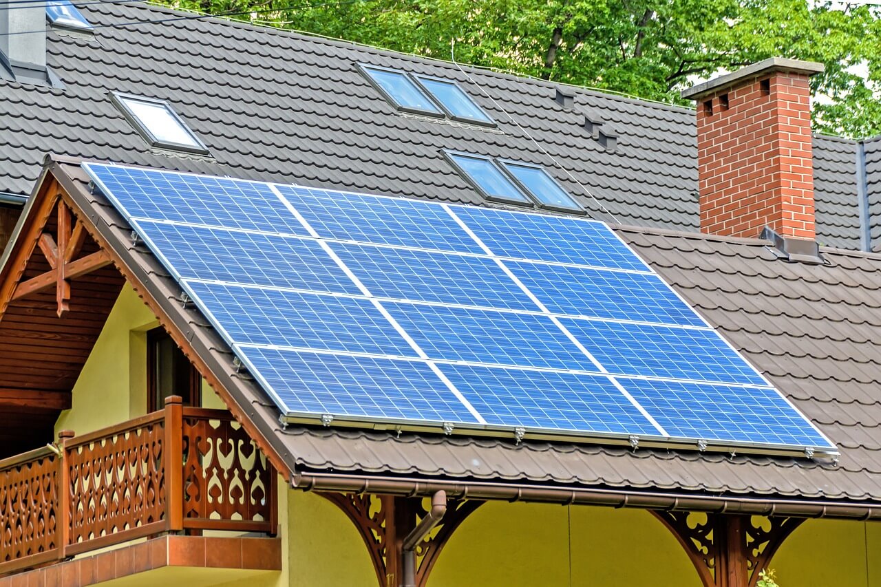 A house with a solar panel on the roof
