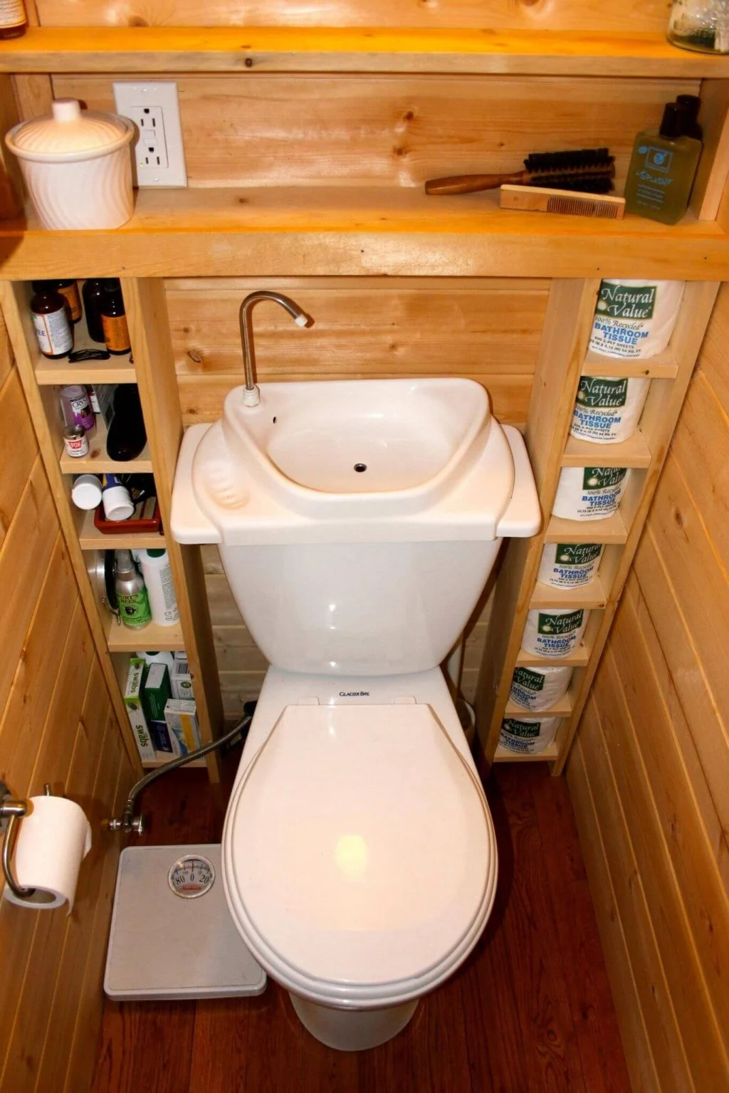  A Toilet/Sink Combo with an Open Shelving Unit
