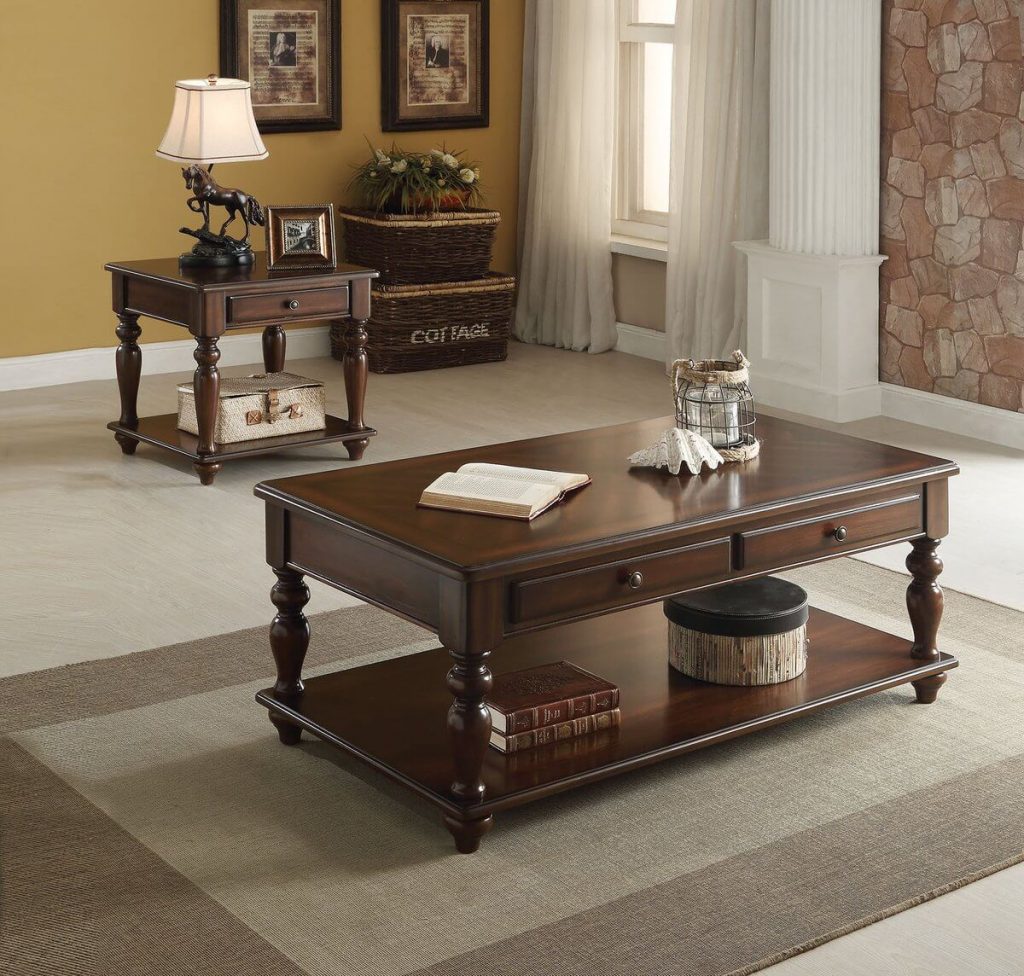 A living room with a coffee table and two end tables
