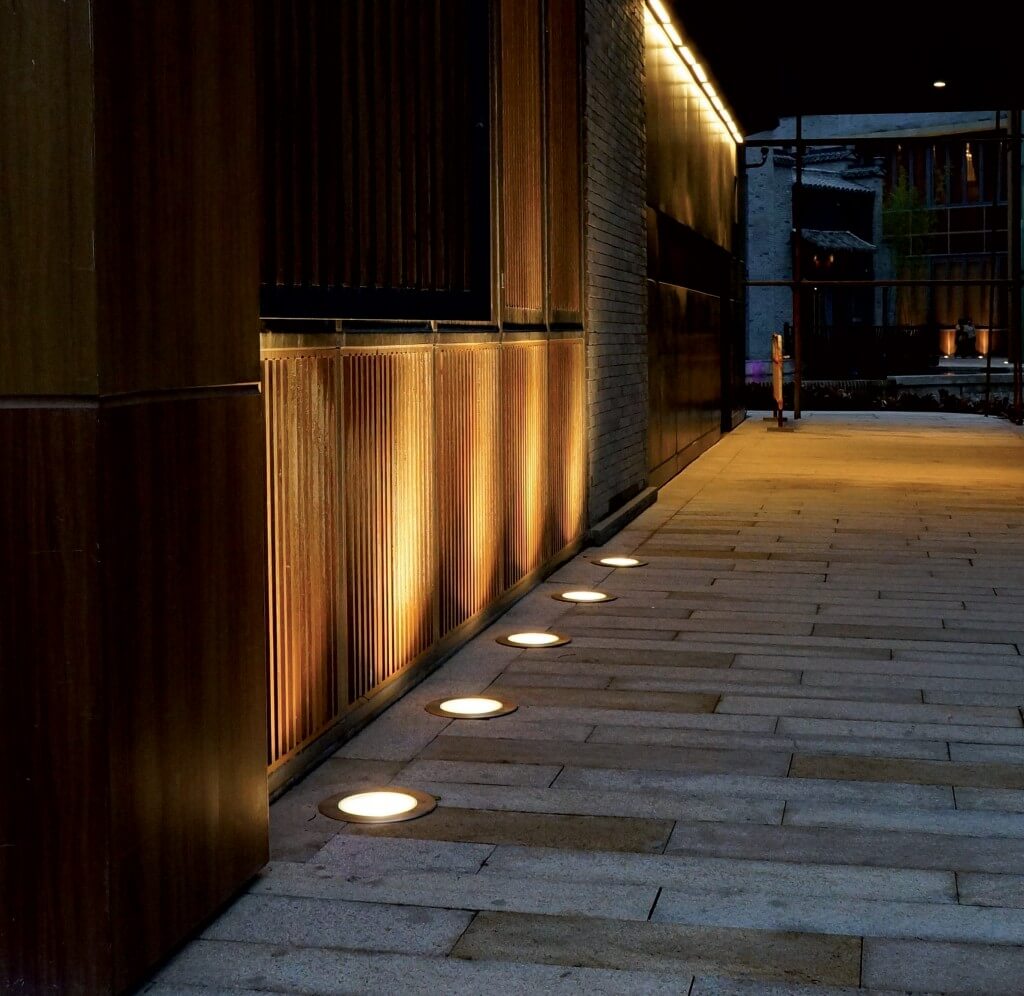 A row of lights that are on the side of a building
