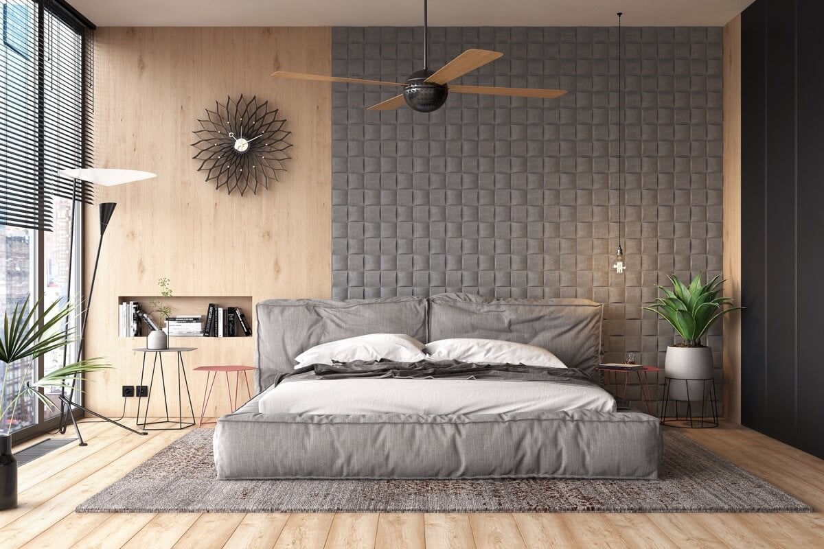 A bedroom with a bed and a ceiling fan
