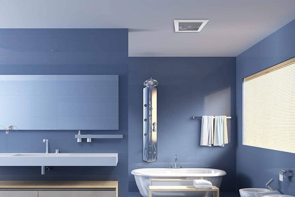 A bathroom with blue walls and white fixtures
