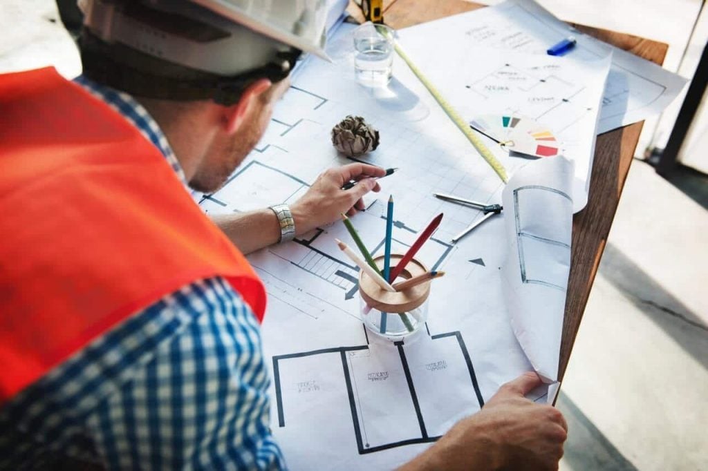 A man in a hard hat working on a project
